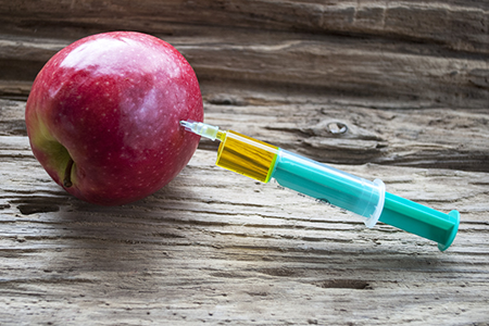 Apfel mit Spritze